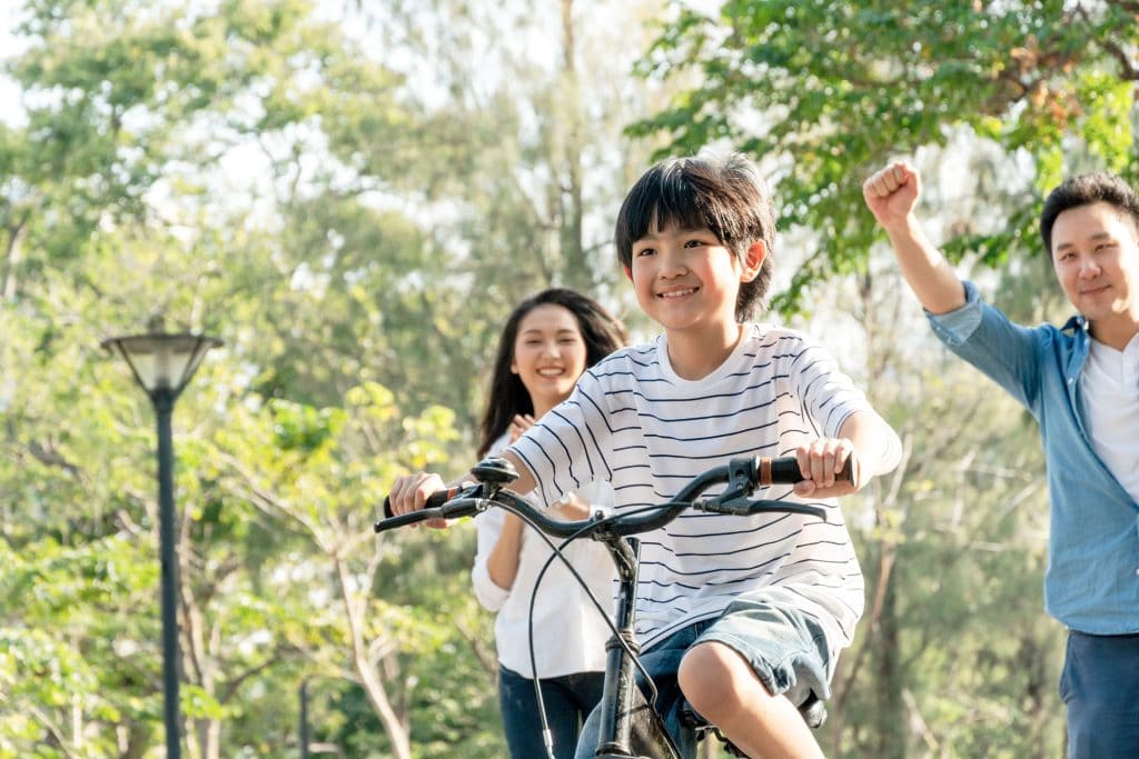 Boy learning to ride a bike