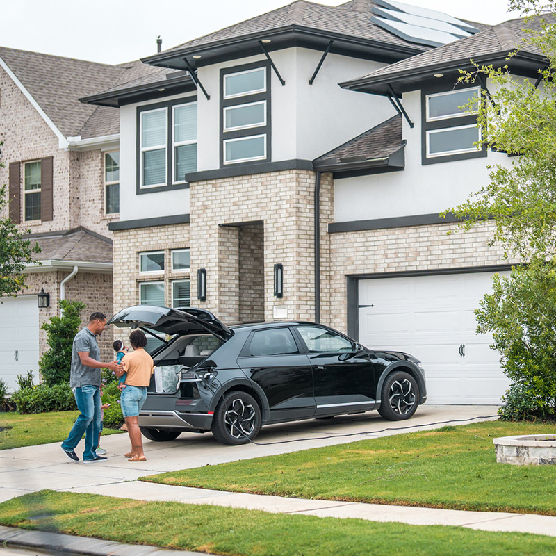Family in their driveway