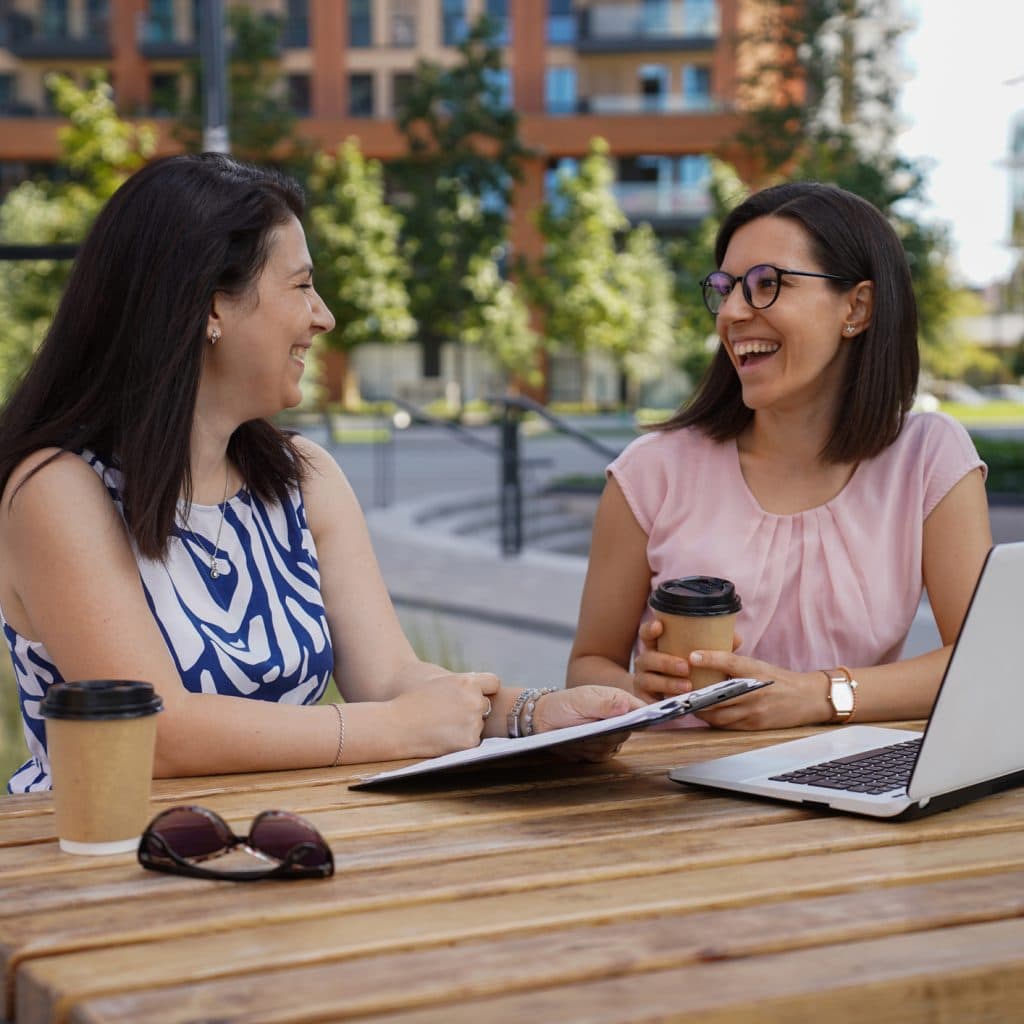Two woman working outdoors